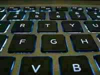 Backlit laptop keyboard, illustrating pips, lots and leverage without the mystique